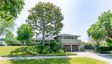 Stunning home surrounded by beautiful mature trees.