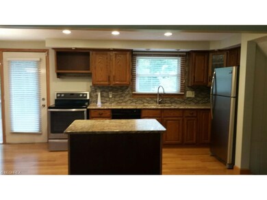 View of kitchen from living room, new stainless ap