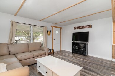 Living room with dark hardwood / wood-style floori