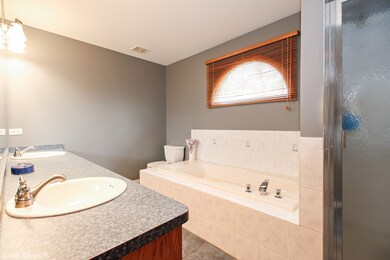 Dual sinks, soaking tub and separate shower.