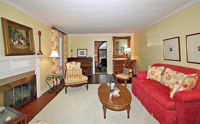 Formal Living room with hardwood floors and crown 