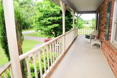 Relax on the large front porch overlooking landscaped front lawn.