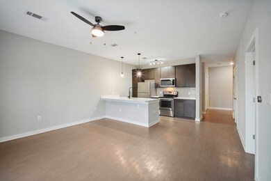 Bedroom with wood finished floors and a ceiling f