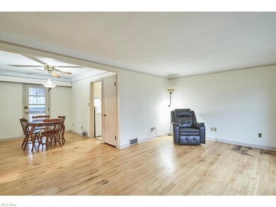 dining room provides entry to deck and fenced in b