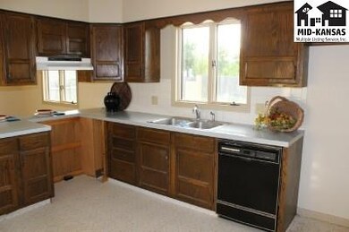 Main bank of cabinets in kitchen wired for electri