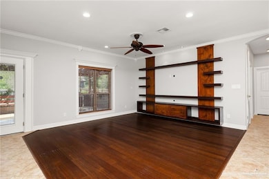Unfurnished living room with recessed lighting, visible vents, ceiling fan, and plenty of natural light