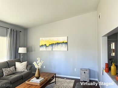Living room with baseboards and dark wood-type flo