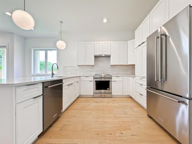 Kitchen featuring appliances with stainless steel