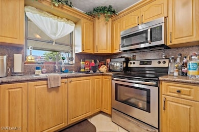 Kitchen featuring stainless steel appliances, deco