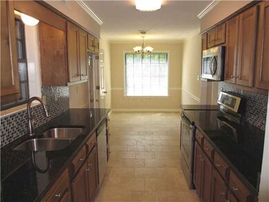 Gorgeous eat-in kitchen with tile backsplash and l