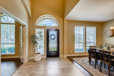 Elegant wide entryway with high ceilings.