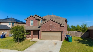 View of front facade featuring a garage,
