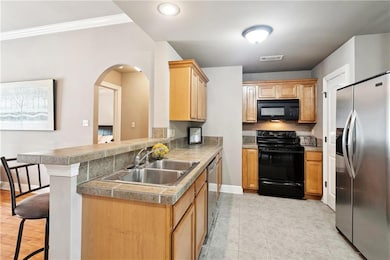 Kitchen opens to living area