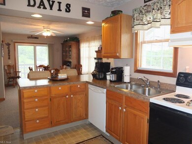 Fully applianced kitchen with breakfast bar.
