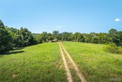 View of wooded area featuring a view of countryside