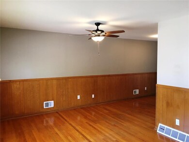 The living room features fresh paint, hardwoods, w