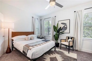 Bedroom featuring carpet flooring and ceiling fan