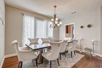 Located off the entry is the formal dining room. Sleek floors, natural lighting, and easy access to the kitchen allow for easy entertainment. Host your next dinner party here for all to enjoy.