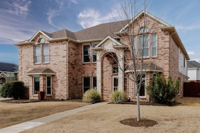 View of front of house with a shingled roof and br