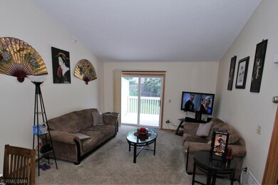 Living room and patio door leading to the HUGE dec