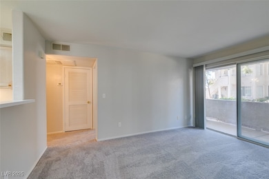 Unfurnished room with carpet floors and baseboards