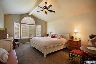 Large master bedroom with walk in closet and brigh