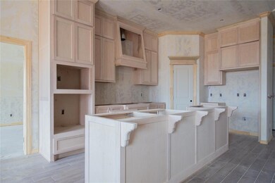 Kitchen featuring a breakfast bar and a center isl