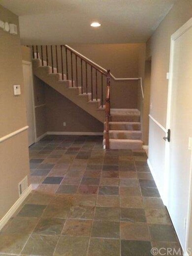 Double front door opens to beautiful slate entry.