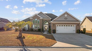 Front facade with a front yard and a garage