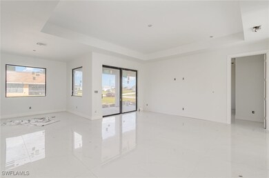 Empty room featuring marble finish floor, baseboar