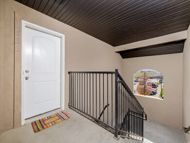Entrance to property with stucco siding