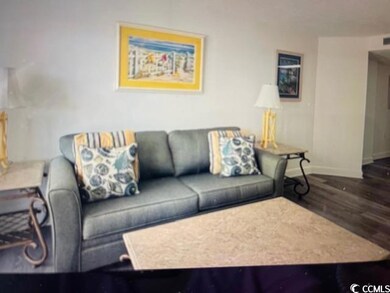 Living room featuring baseboards and wood finished