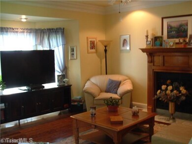 Living Room. A great living room which offers large crown molding, wood flooring, gas log fireplace, large windows to provide natural lighting, 10  ceilings, bay window, built-in surround sound & accent lighting.