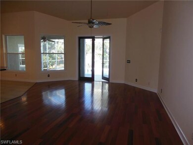 LIVING ROOM WITH WOOD FLOORS LEADING OUT TO LANAI 