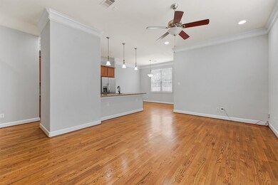 Crown molding and wood flooring downstairs gives a