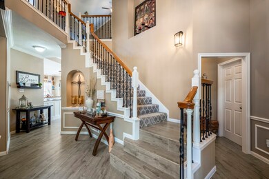 Stairs lead upstairs to the game room and 3 secondary bedrooms.