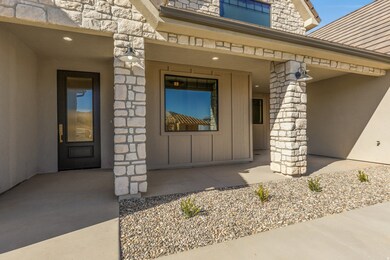 Property entrance featuring stone siding