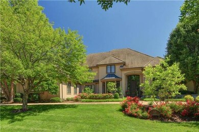 Lush landscape surrounds the perimeter of this 4 b