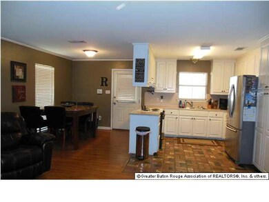 View of kitchen and dining from family room