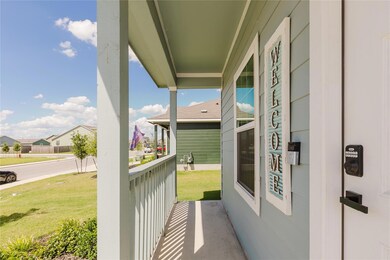 Covered porch with a yard