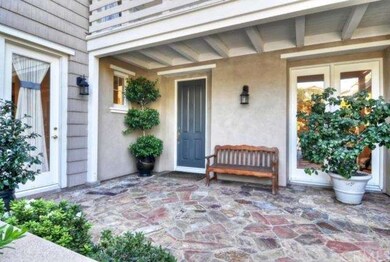 Stone courtyard entry and 3 car garage with epoxy 