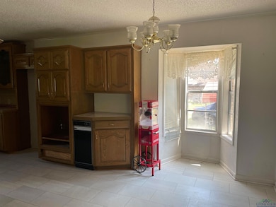 Kitchen featuring hanging light fixtures, a notabl