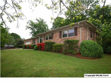 View of side and front. Fenced yard with gate at side of yard.