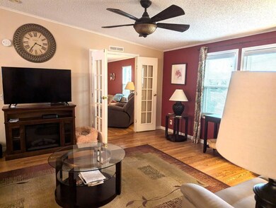 Living room with separate den