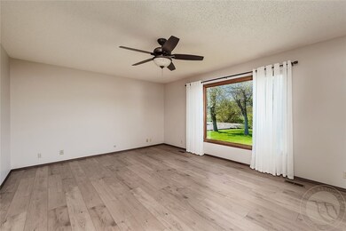 Living room with wide picture window to the Yellow