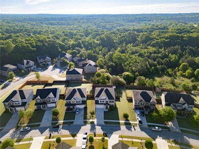 Aerial perspective of suburban area with a forest