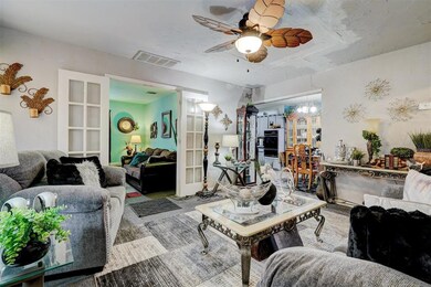 Living area featuring visible vents, french doors,