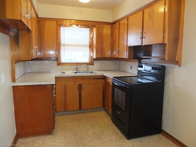 The kitchen comes applianced with an electric oven