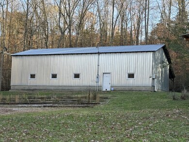 Awesome 30x50 shop with office. 220 separate electric service. High ceilings. 14.5 foot high double sliding doors & 2 walk in doors concrete floor plus 10 x 50 attached bay.