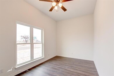 The front bedroom has two large windows bringing i
